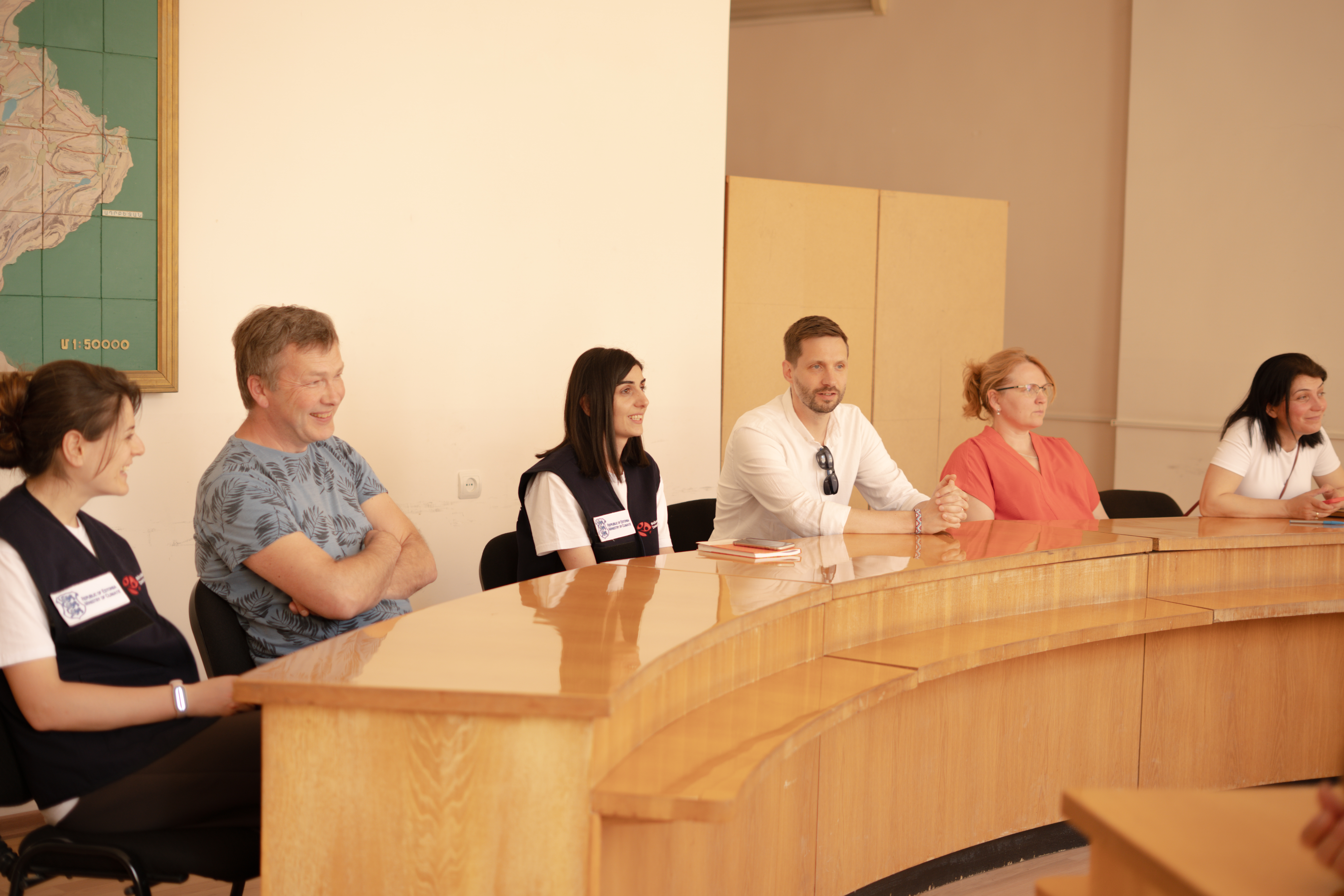People sitting at a table discussing 