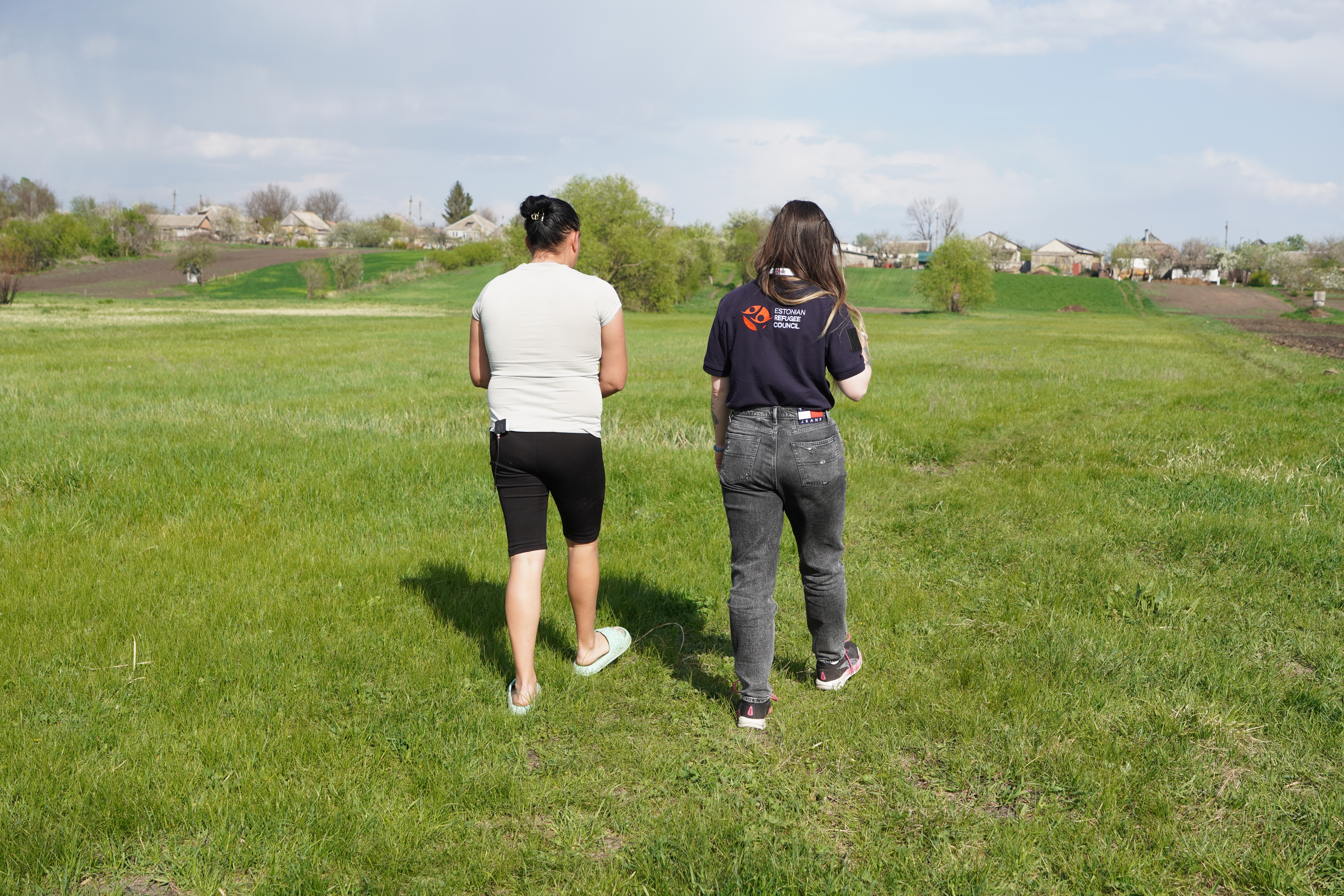 Alina, participant of the programme, shows ERC team a pasture
