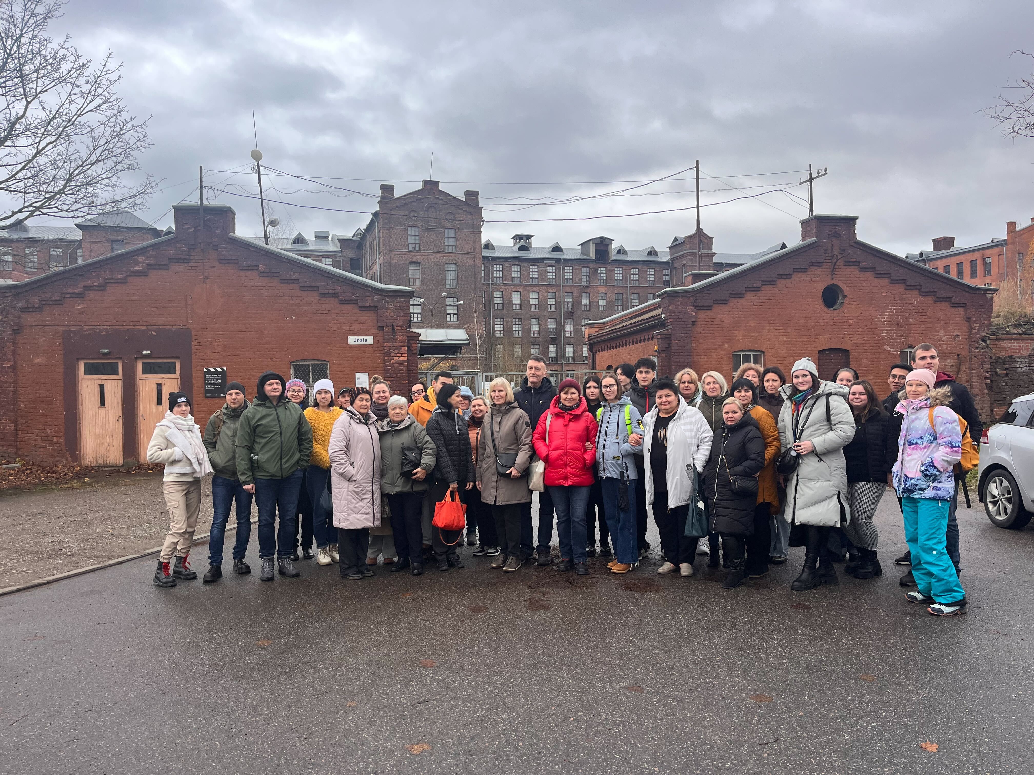 People standing infront of a building 