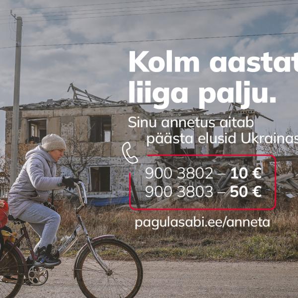 Woman on a bicycle with a child in war torn Ukraine